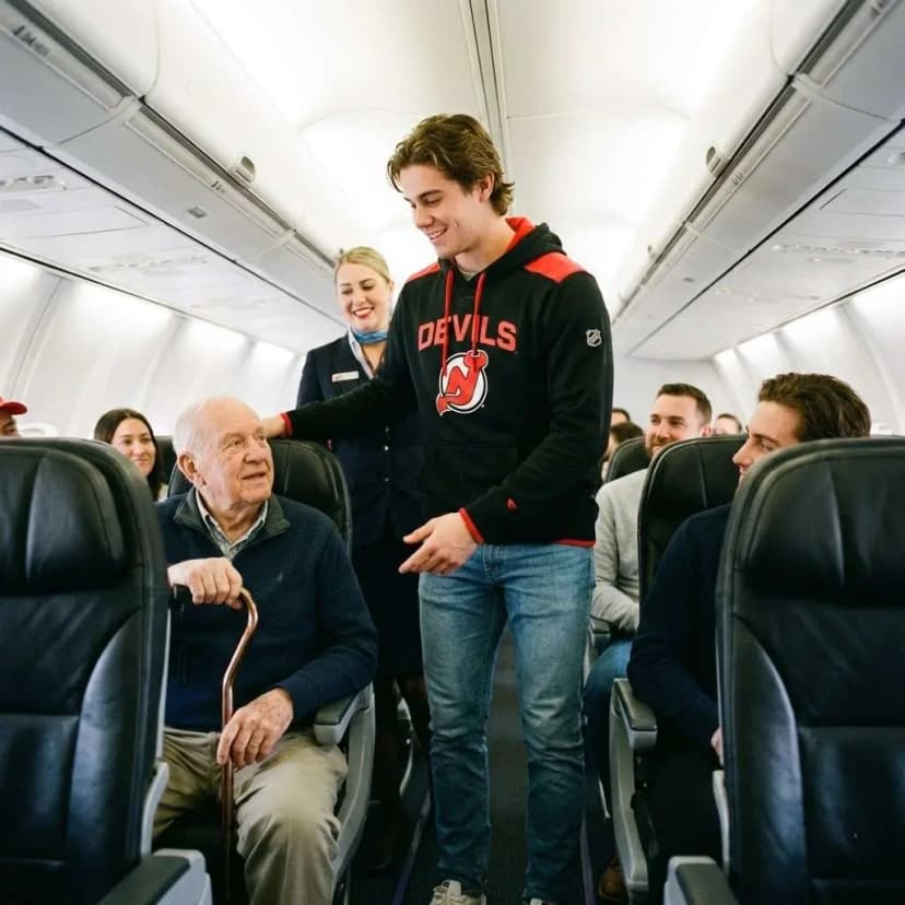 BREAKING NEWS: The entire NHL world is buzzing after New Jersey Devils captain Jack Hughes stunned passengers on a commercial flight with an unexpected gesture. According to multiple witnesses, he quietly gave up his first-class seat to an elderly U.S. veteran just moments before takeoff—but that was only the beginning. What Jack Hughes did next, out of view of cameras and without saying a word, brought the entire cabin to tears and left flight attendants speechless…